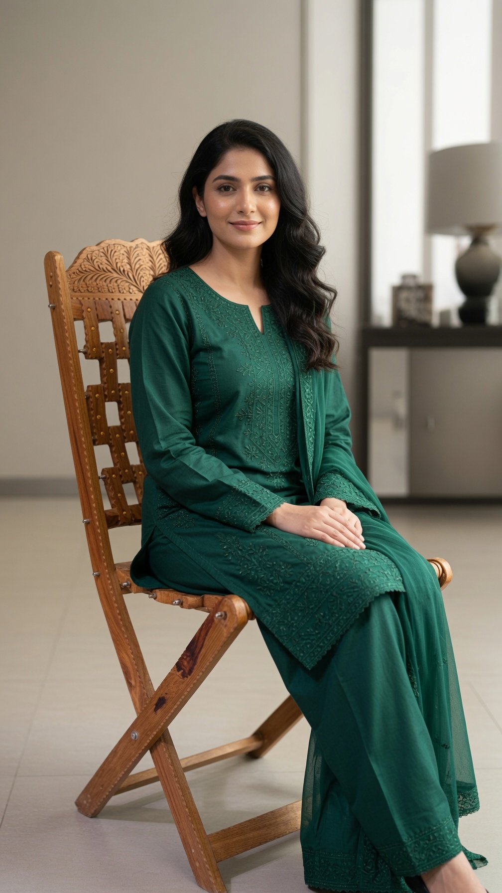 Our model seated on a hand-carved folding chair in sheesham
