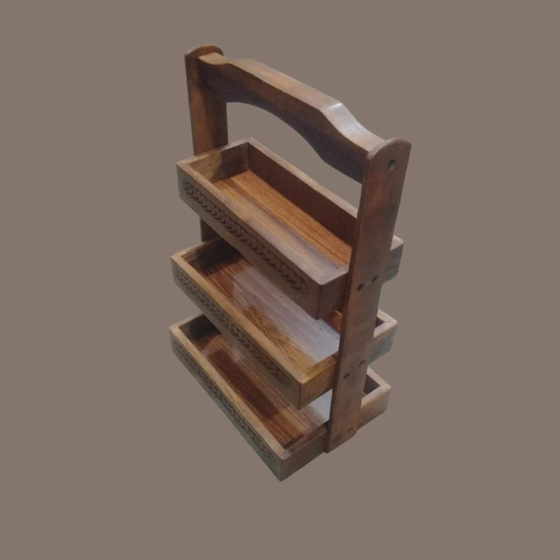 Three-tier sheesham cutlery caddy with carved trays and a turned carrying handle