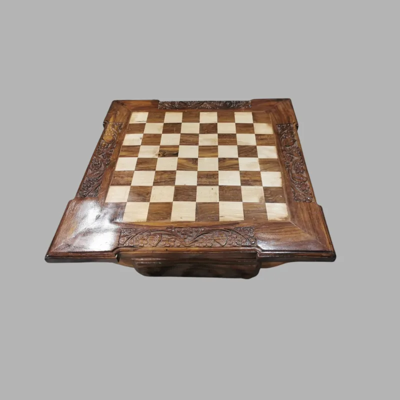 Hand-carved sheesham chess board with light and dark squares and a carved floral border