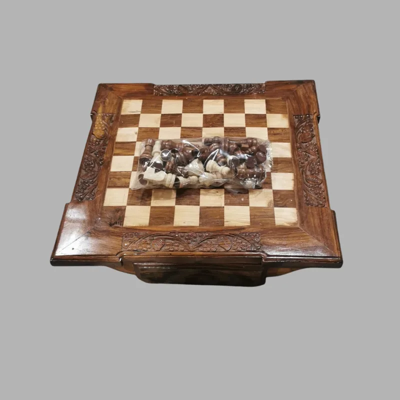 The chess board with its full set of turned wooden pieces