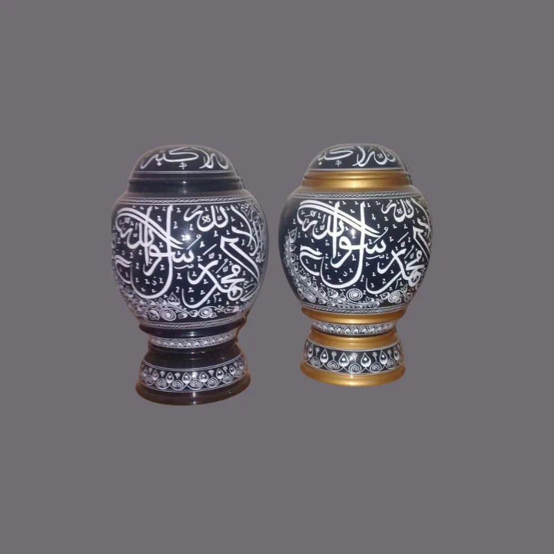 Two dark blue lidded wooden jars with the Kalima written around them in white