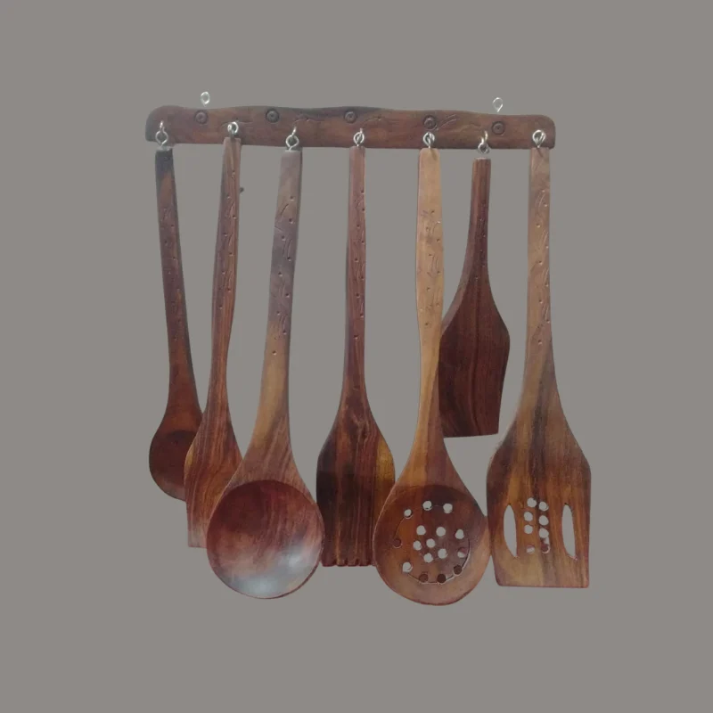 Wooden wall rack hung with six sheesham cooking utensils including ladles and a spatula