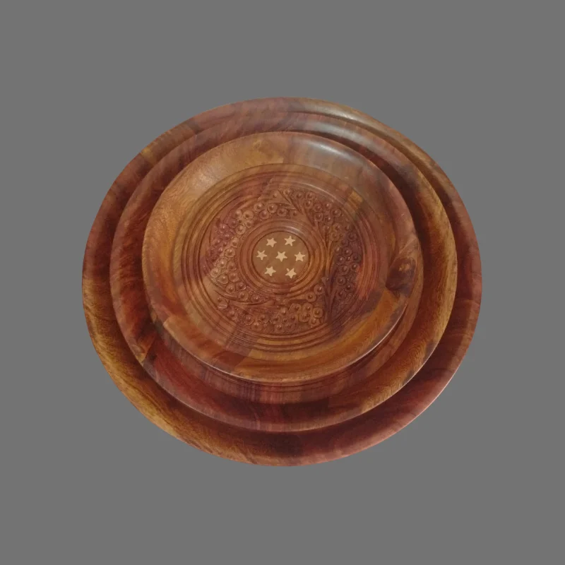 Three nested sheesham plates with hand-carved floral centres