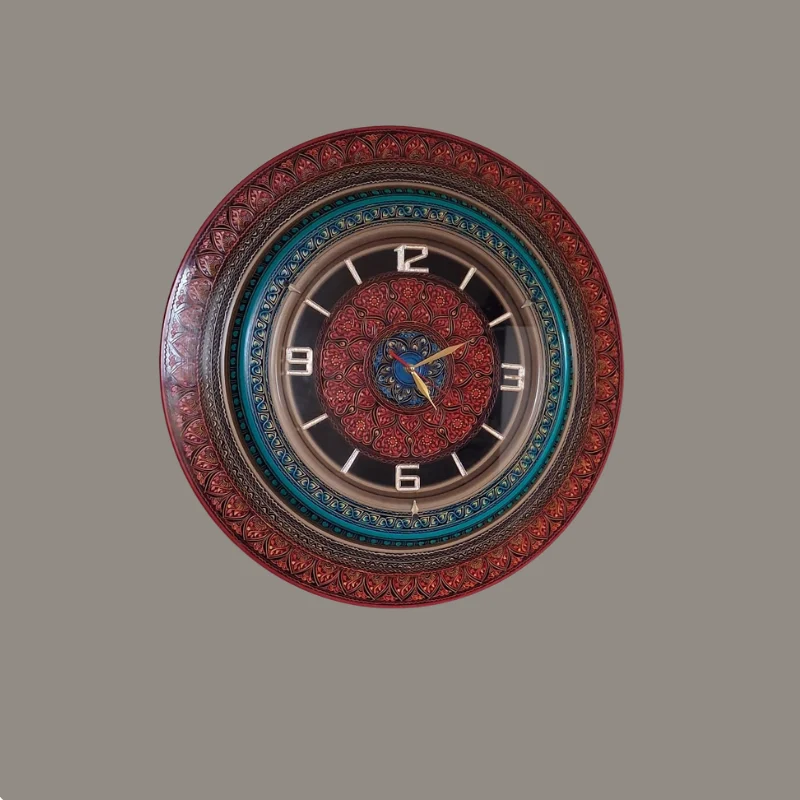 Round wall clock with a hand-painted floral bezel in red and blue and gold numerals