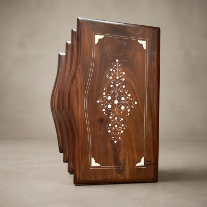 Carved sheesham table top with a white inlay pattern running down the centre