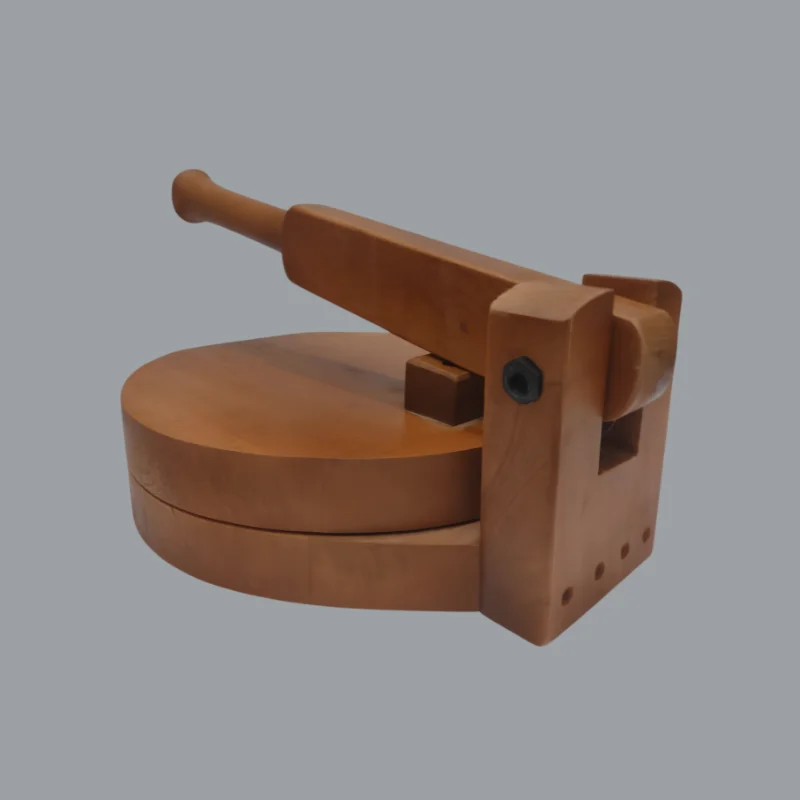 10 inch hinged wooden roti maker open beside a stack of rotis