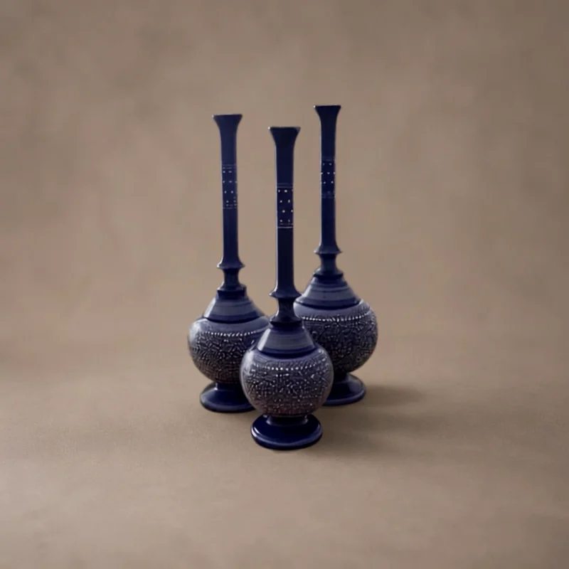 Three long-necked blue and white naqshi surahis of graduated height