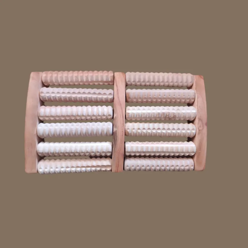 Wooden foot massager with two rows of rollers being used under bare feet