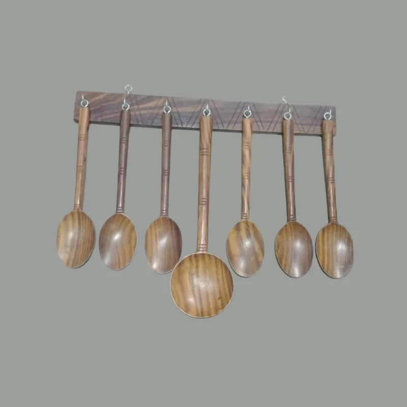 Six sheesham wood serving spoons laid out in a fan