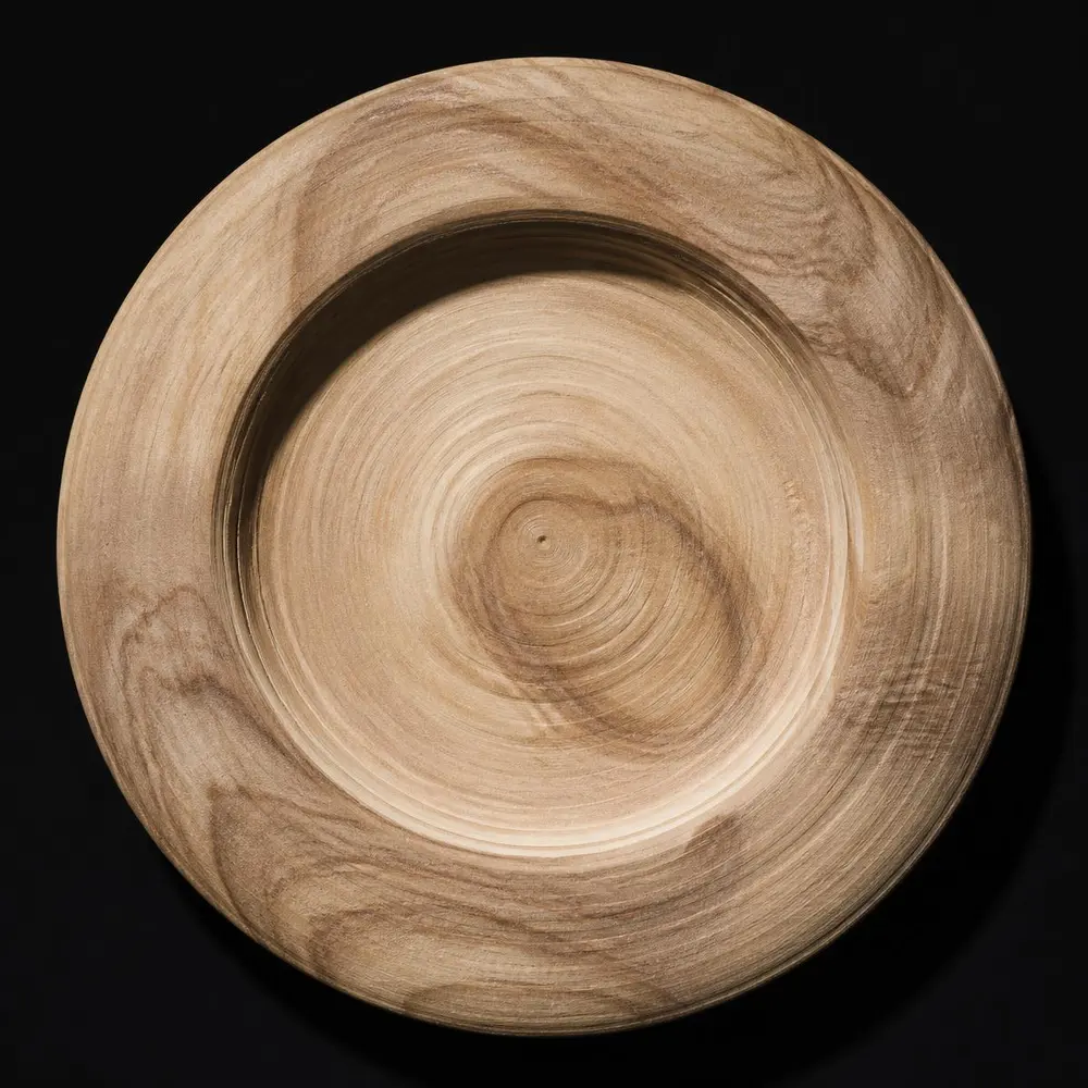 A raw turned rosewood disc before lacquering