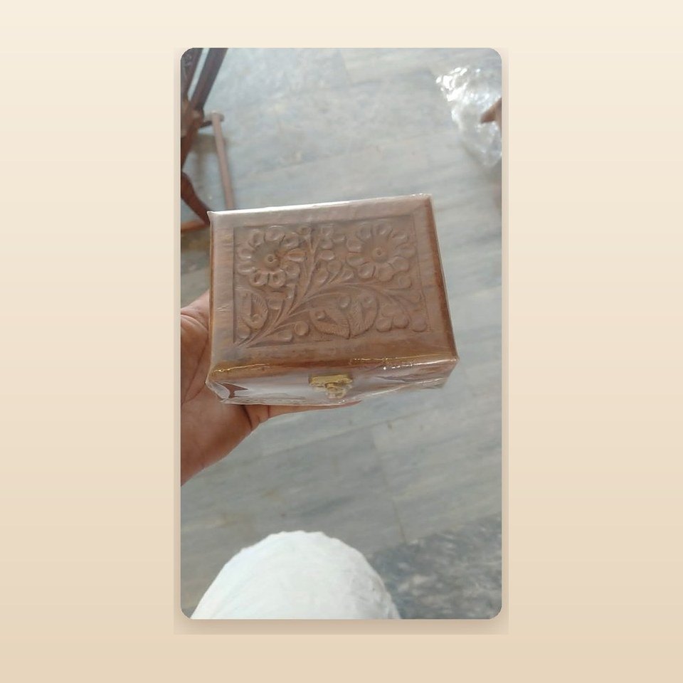 Hand-carved sheesham box with a floral pattern cut across the whole lid
