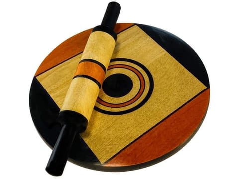 Painted wooden chakla board with a matching rolling pin