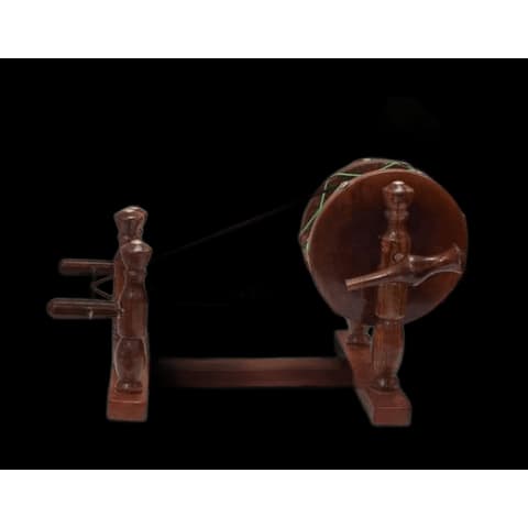 Hand-carved sheesham wood charkha spinning wheel replica with a taut string and turned spindle post
