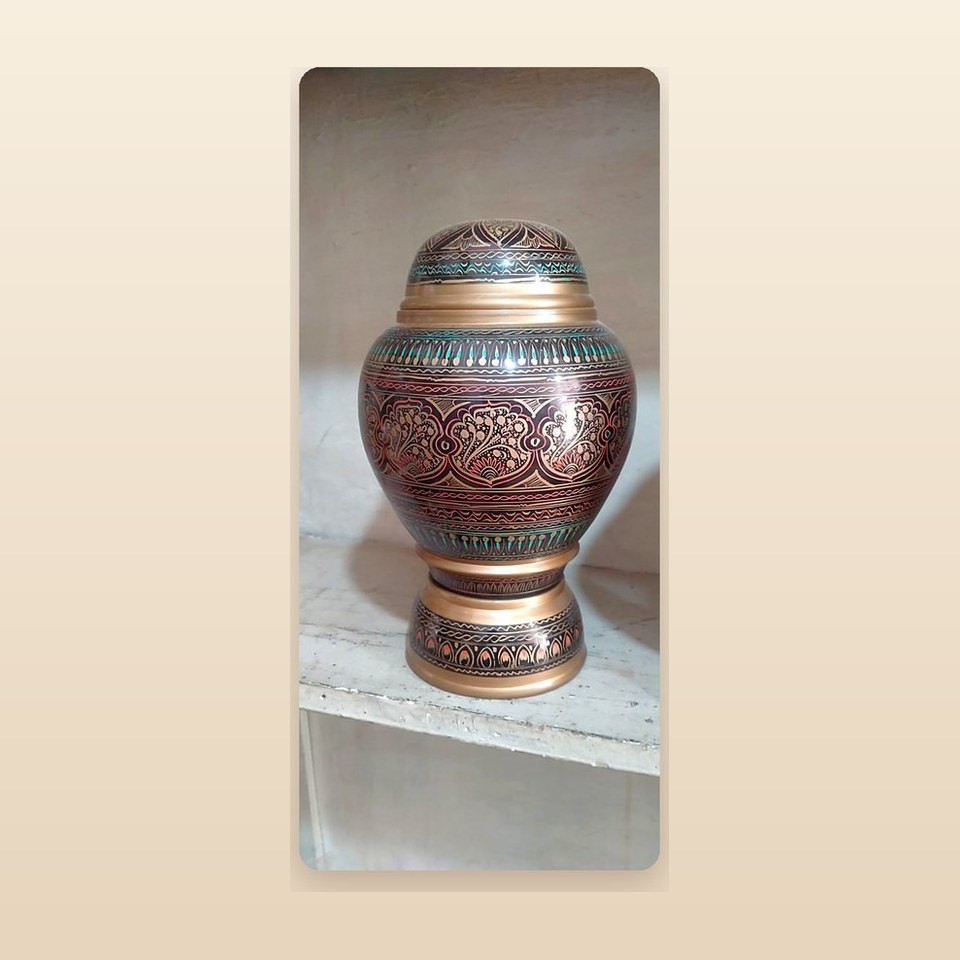 Tall lidded wooden urn in copper and teal lacquer with dense scratched detail