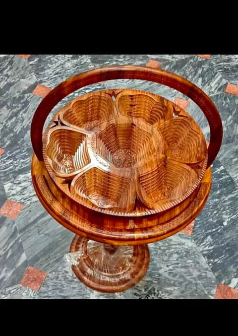 Wooden dry fruit basket with divided sections and a curved handle