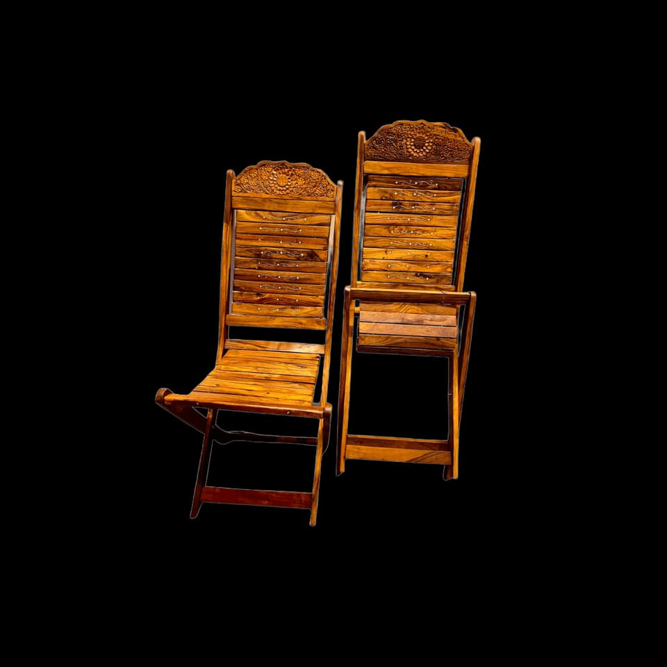 Pair of slatted sheesham folding chairs with carved backrests