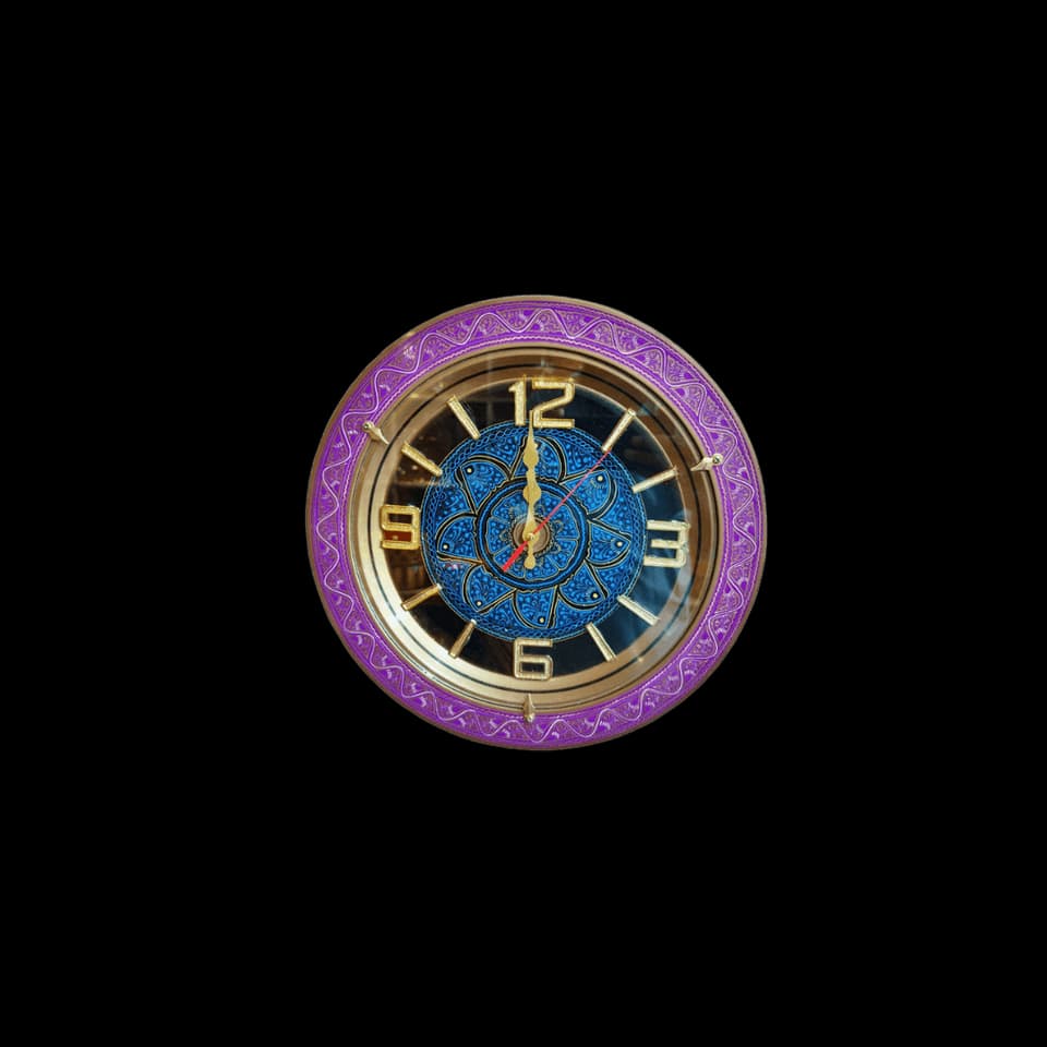 Round wall clock with a hand-painted floral bezel in red and blue and gold numerals
