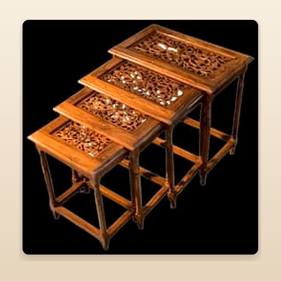 Set of four carved sheesham nesting tables stacked one inside the other