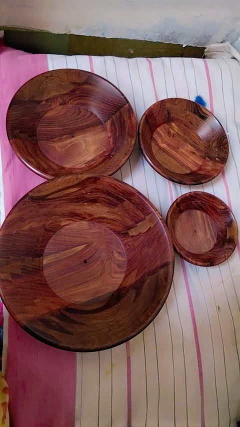 Wooden serving plates with matching small bowls
