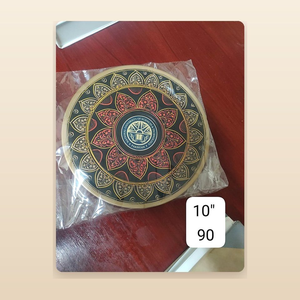 Ten inch lacquered plate with a scratched medallion at the centre