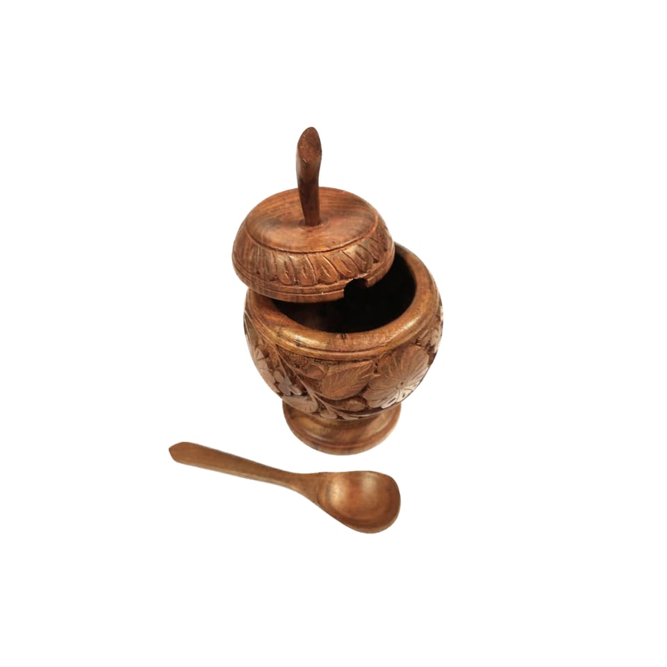 Carved sheesham sugar pot with its lid tilted open and a wooden spoon beside it