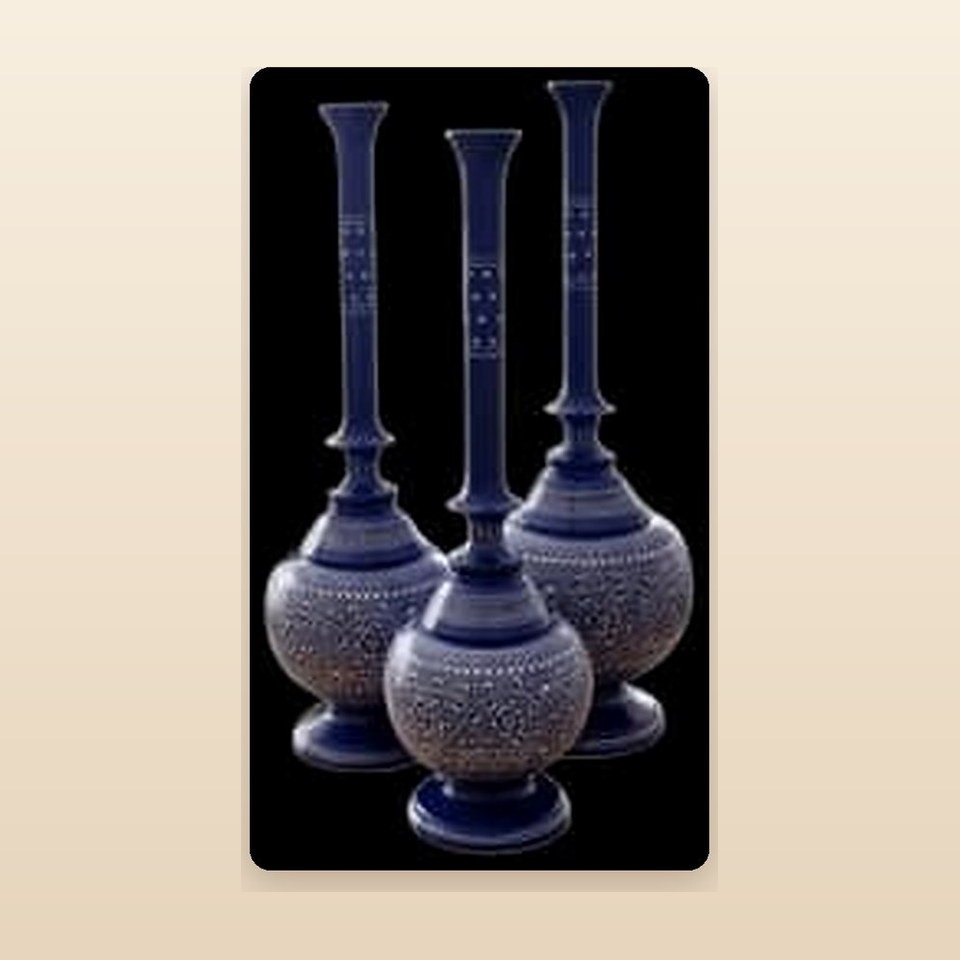 Three long-necked blue and white naqshi surahis of graduated height