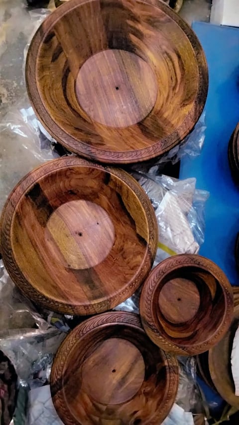 Large wooden salad bowl with smaller matching bowls