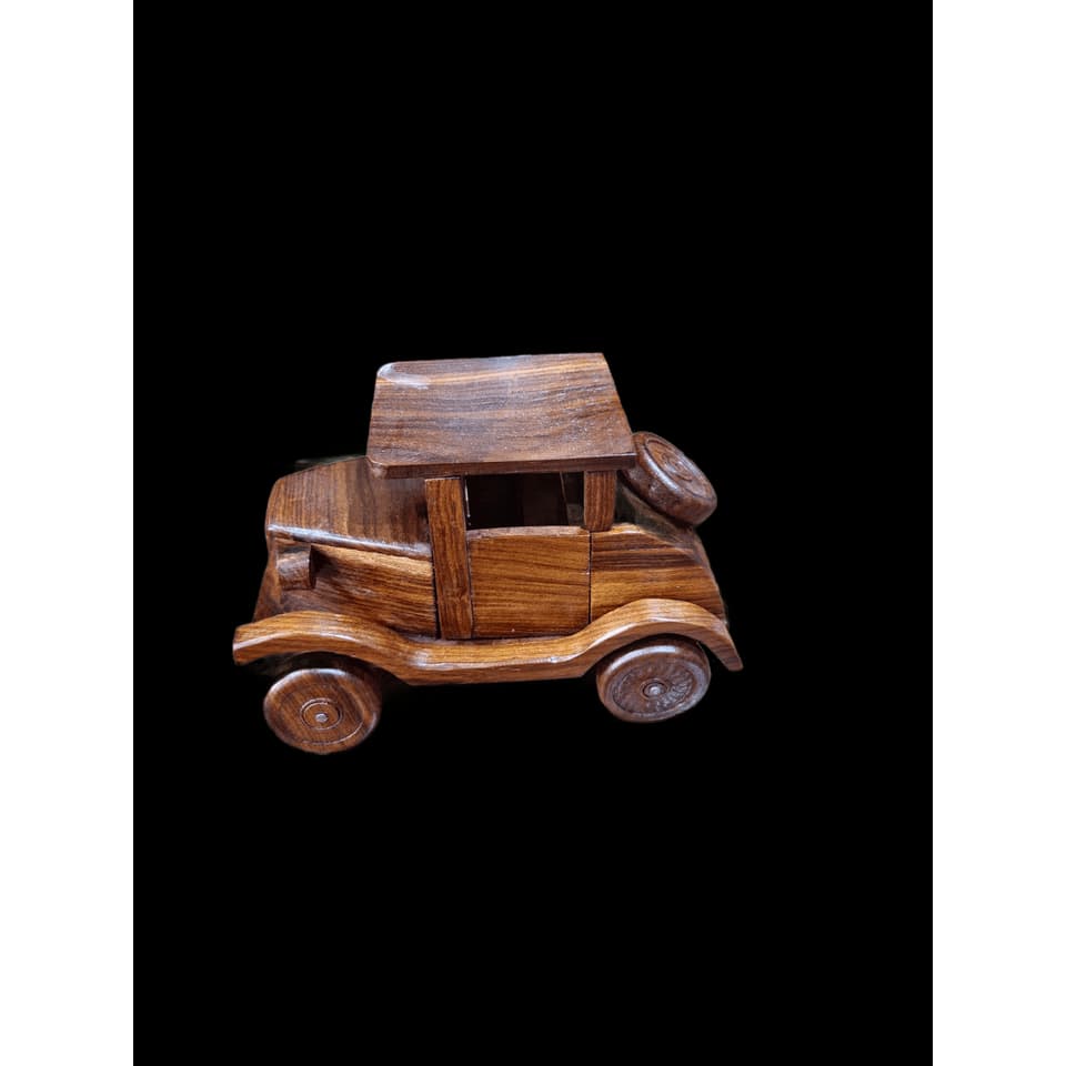 Hand-assembled sheesham 1920s enclosed sedan with a flat roof, running boards and a side-mounted spare wheel
