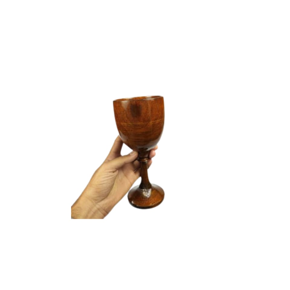 Hand holding a turned sheesham wood goblet with a tall stem