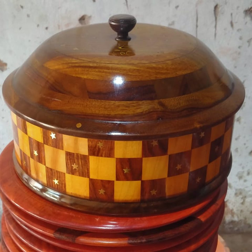 Twelve inch wooden hot pot with a domed lid and a chessboard mosaic band of dark and pale wood set with brass stars