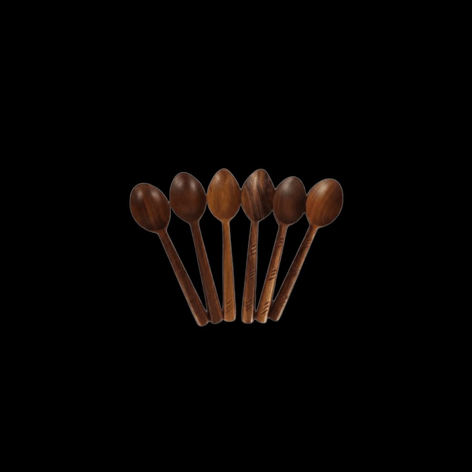 Six sheesham wood serving spoons laid out in a fan
