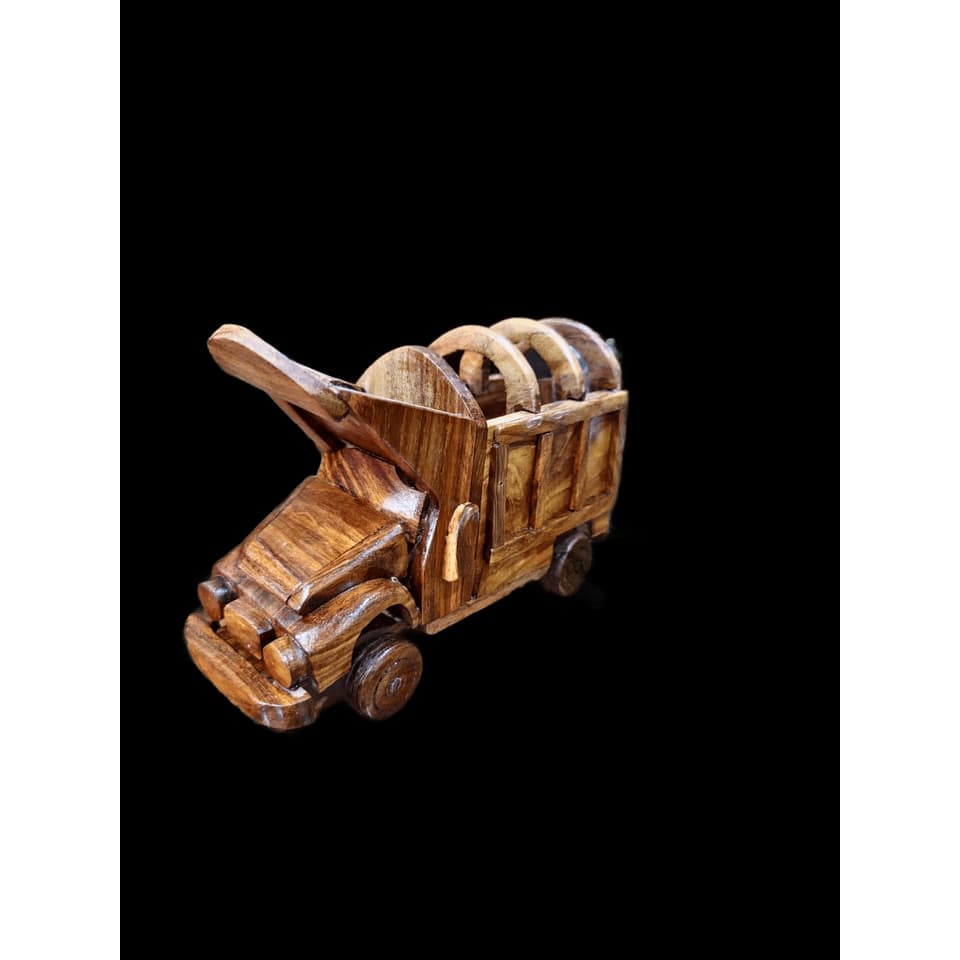 Handcrafted sheesham wood dump truck with rolling wheels and a tipping cargo bed