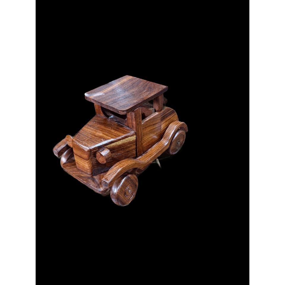 Hand-assembled sheesham wood 1920s open-top touring car with round headlamps and a rear spare tyre